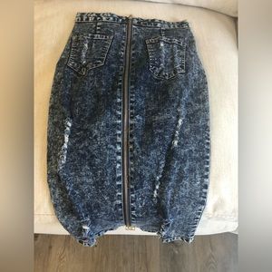 Denim skirt with zip up back. Distressed denim size M.